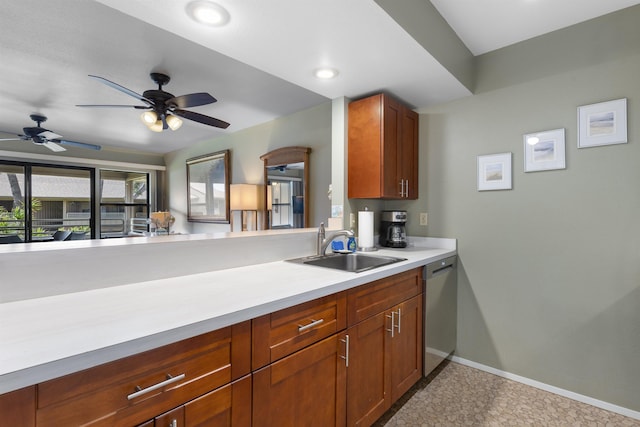 kitchen featuring kitchen peninsula, dishwasher, sink, and ceiling fan