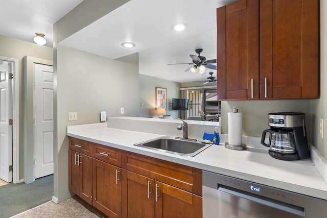 kitchen featuring dishwasher, light carpet, sink, ceiling fan, and kitchen peninsula