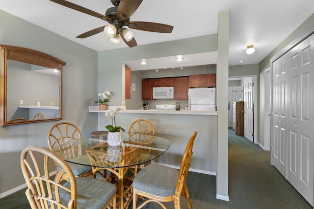 carpeted dining area featuring ceiling fan