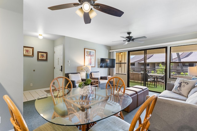 dining space featuring tile patterned floors and ceiling fan