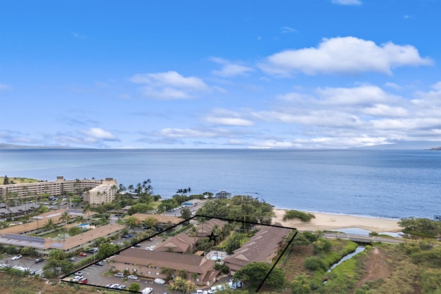 bird's eye view featuring a view of the beach and a water view