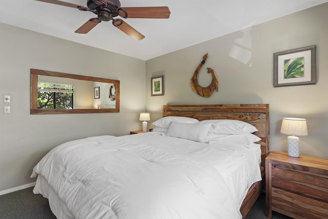 bedroom featuring dark colored carpet and ceiling fan