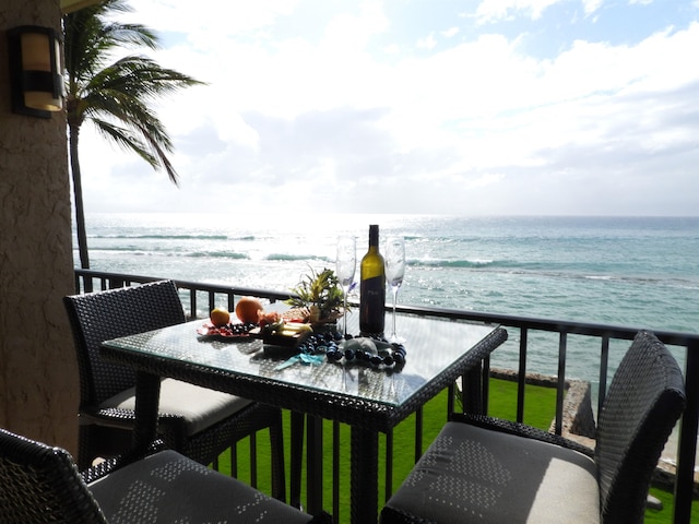 balcony featuring a water view