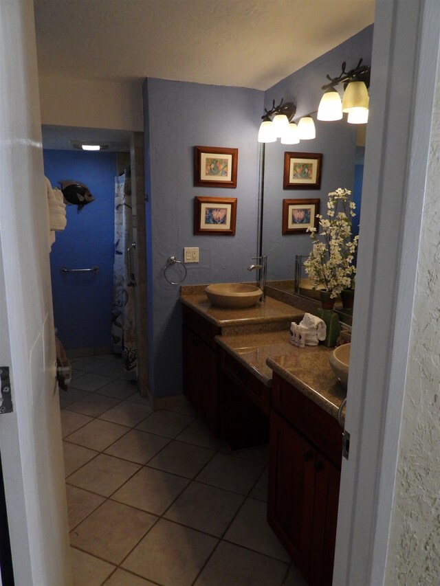 bathroom featuring tile flooring and oversized vanity