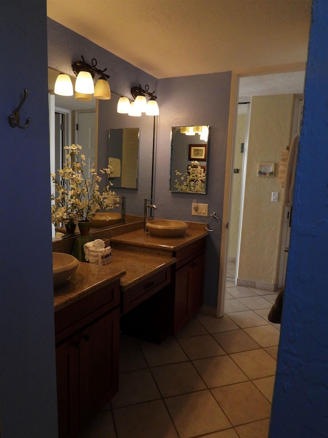 bathroom with double sink vanity and tile floors