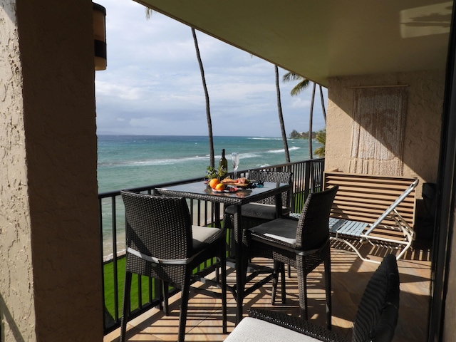 balcony featuring a water view