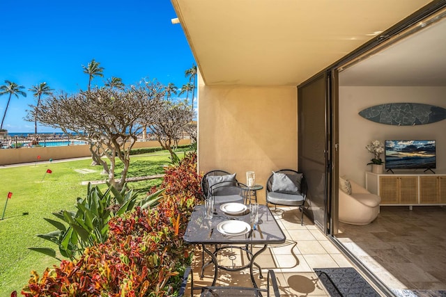 view of patio with a water view