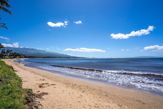 view of water feature featuring a mountain view and a beach view