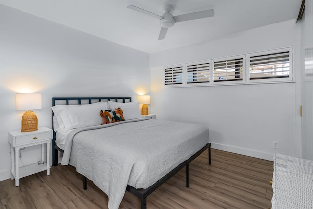 bedroom with wood-type flooring and ceiling fan