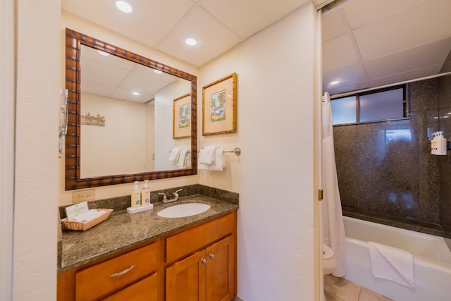 bathroom featuring recessed lighting, a paneled ceiling, vanity, toilet, and shower / tub combo