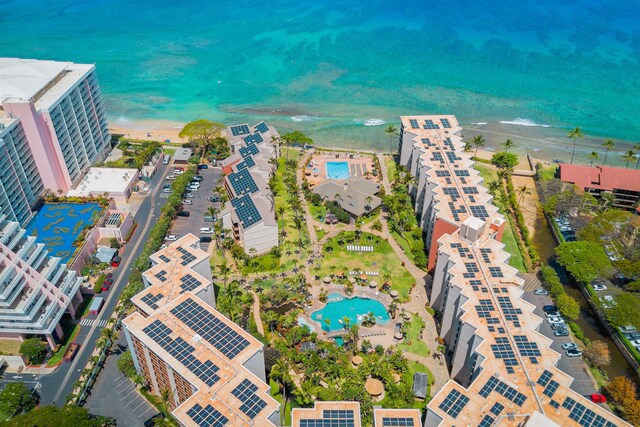 birds eye view of property with a beach view and a water view
