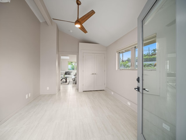 spare room with ceiling fan and baseboards