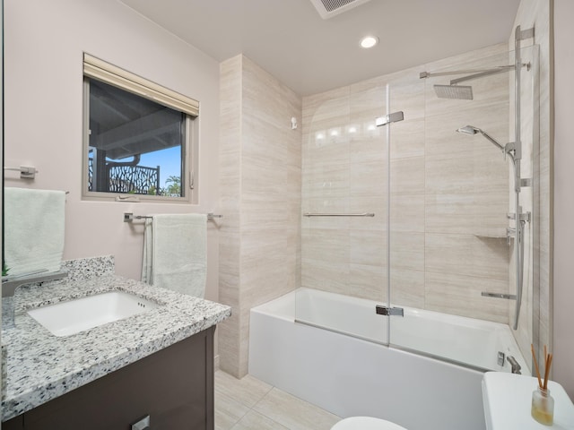 full bath with combined bath / shower with glass door, recessed lighting, tile patterned floors, and vanity