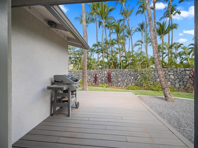 wooden deck featuring area for grilling and fence