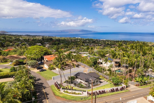 aerial view of residential area featuring a large body of water