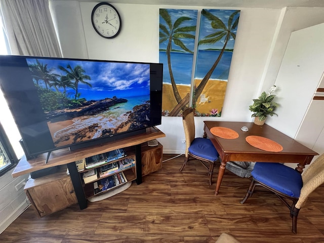 sitting room featuring plenty of natural light and wood finished floors