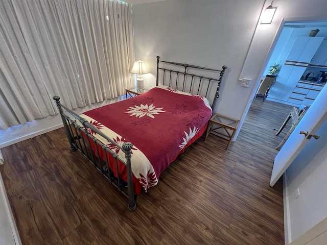 bedroom featuring wood finished floors