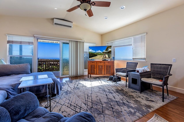 living room featuring hardwood / wood-style floors, ceiling fan, a wall mounted AC, and plenty of natural light