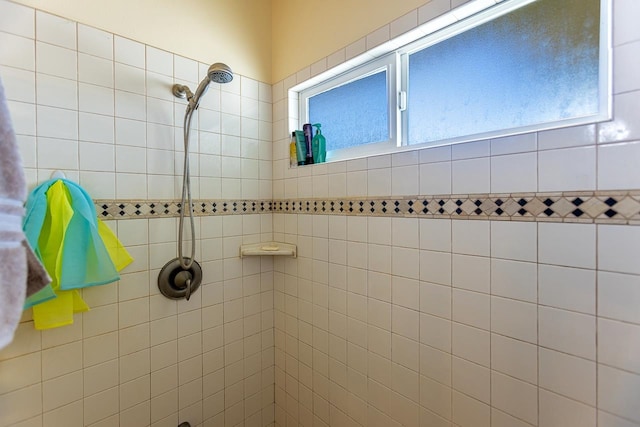 bathroom with a tile shower