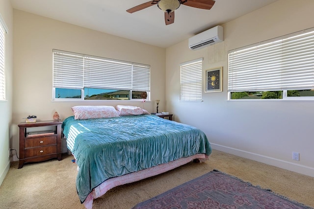 carpeted bedroom with a wall mounted AC and ceiling fan