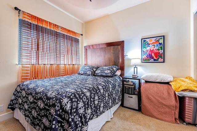 bedroom featuring light colored carpet