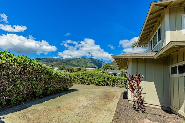 exterior space with a mountain view and a patio