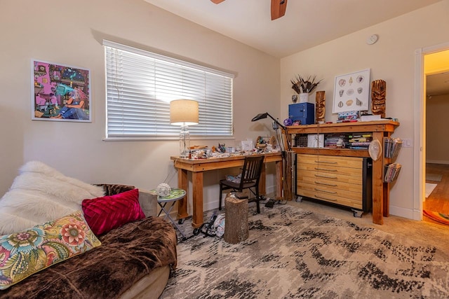 office area with ceiling fan and carpet floors