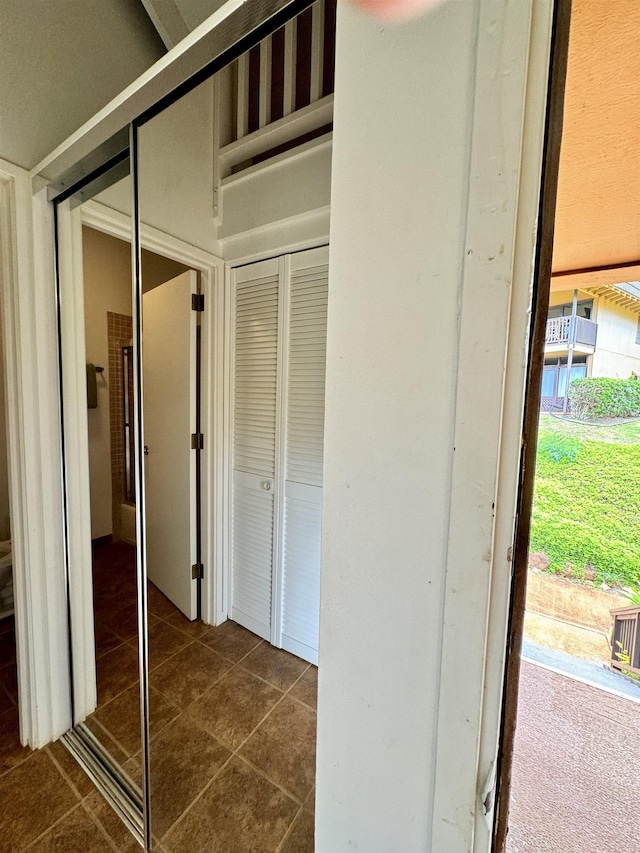 interior space with dark tile patterned floors