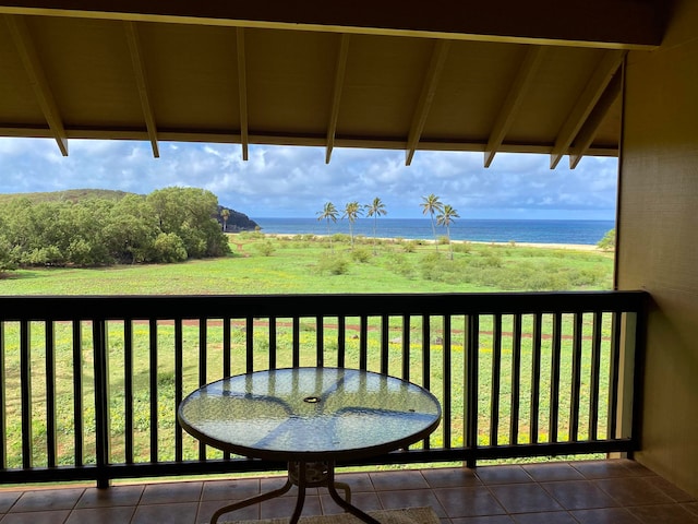 balcony featuring a deck with water view