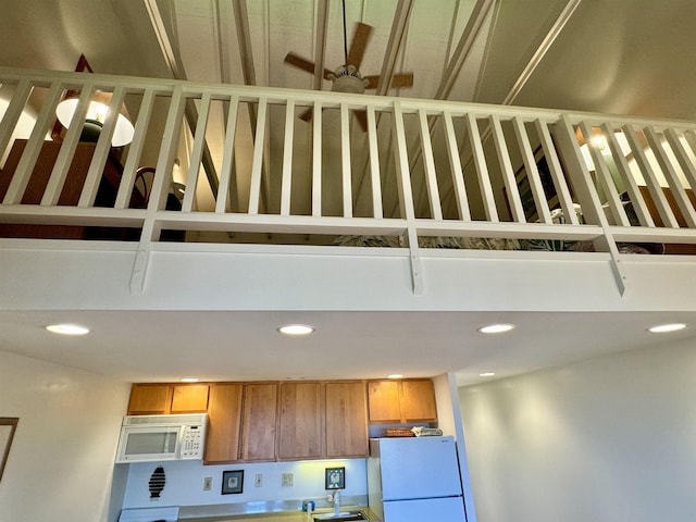 interior space featuring sink and refrigerator