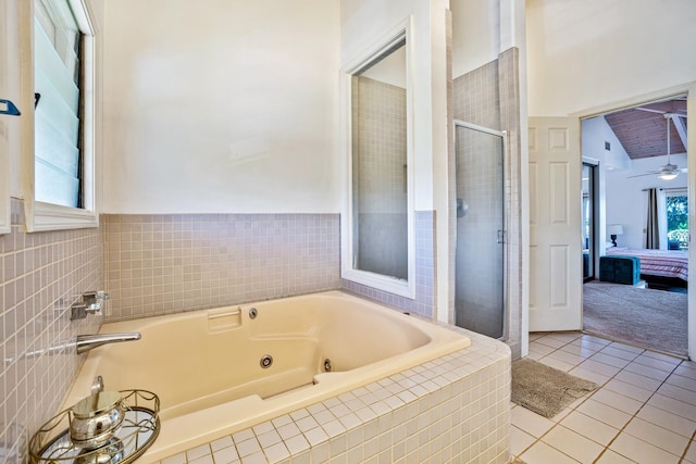 bathroom featuring lofted ceiling, plus walk in shower, tile patterned floors, and ceiling fan