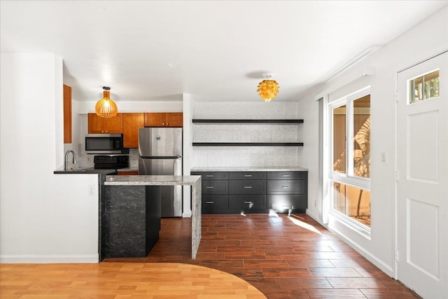 kitchen with baseboards, brown cabinetry, appliances with stainless steel finishes, dark wood-style flooring, and open shelves