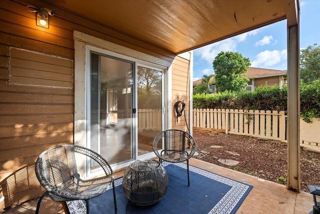 view of patio / terrace featuring fence