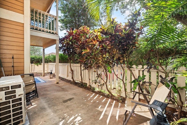 view of patio / terrace with a fenced backyard and a balcony