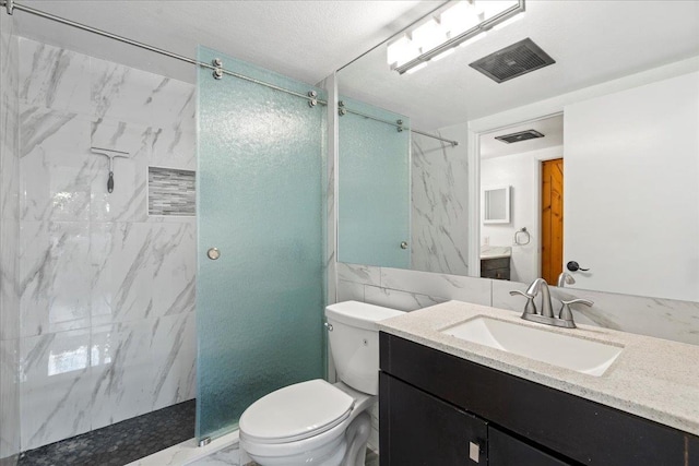 full bath featuring toilet, a marble finish shower, visible vents, and vanity