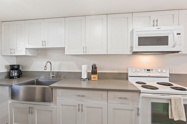 100 Hauoli St Unit 303, Wailuku, HI 96793 - kitchen with white appliances, white cabinetry, and light countertops