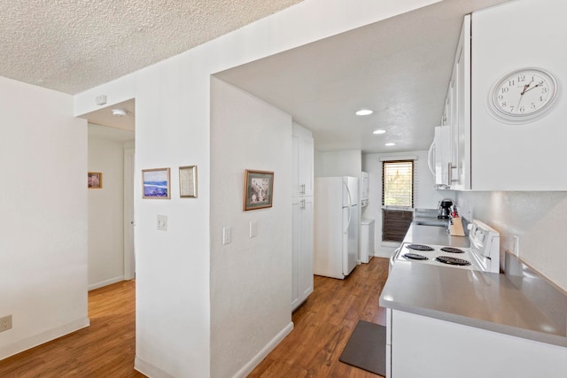 100 Hauoli St Unit 303, Wailuku, HI 96793 - kitchen with white appliances, white cabinetry, wood finished floors, and recessed lighting