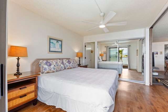 100 Hauoli St Unit 303, Wailuku, HI 96793 - bedroom featuring a textured ceiling, wood finished floors, access to outside, and ceiling fan