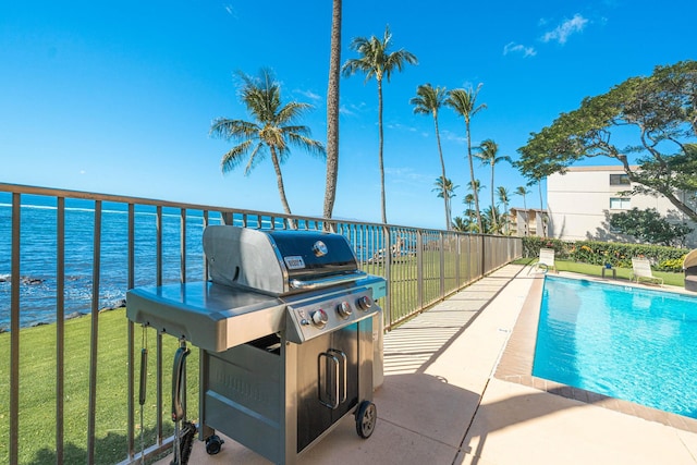 100 Hauoli St Unit 303, Wailuku, HI 96793 - community pool featuring area for grilling, a water view, and a lawn