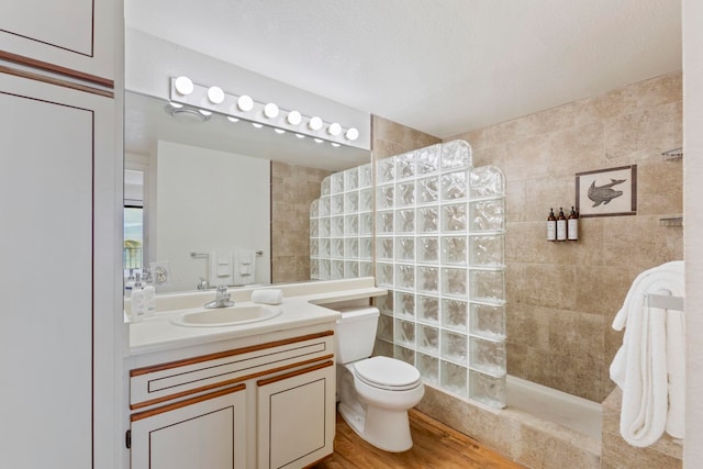 100 Hauoli St Unit 303, Wailuku, HI 96793 - bathroom with walk in shower, vanity, and wood finished floors