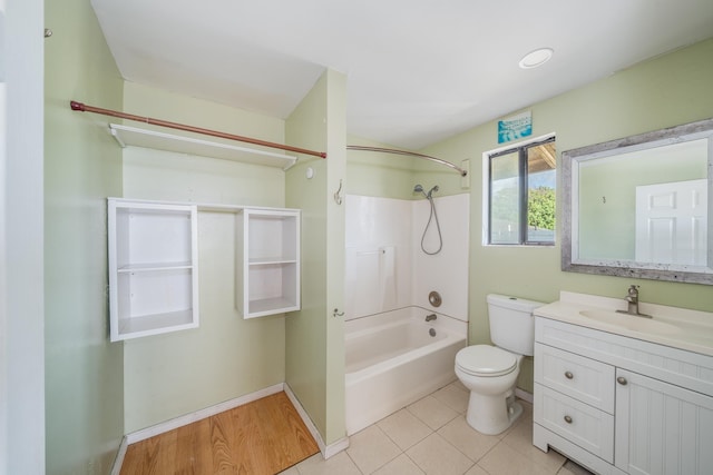 full bath featuring vanity, tile patterned floors, shower / bath combination, and toilet