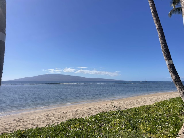 water view featuring a beach view and a mountain view