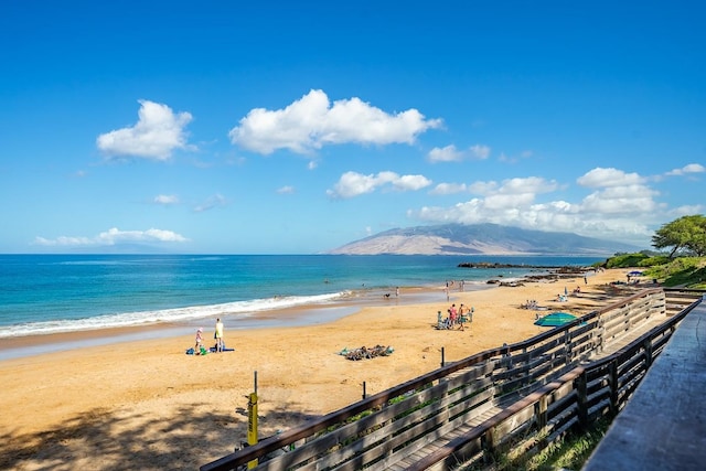 property view of water with a view of the beach and a mountain view