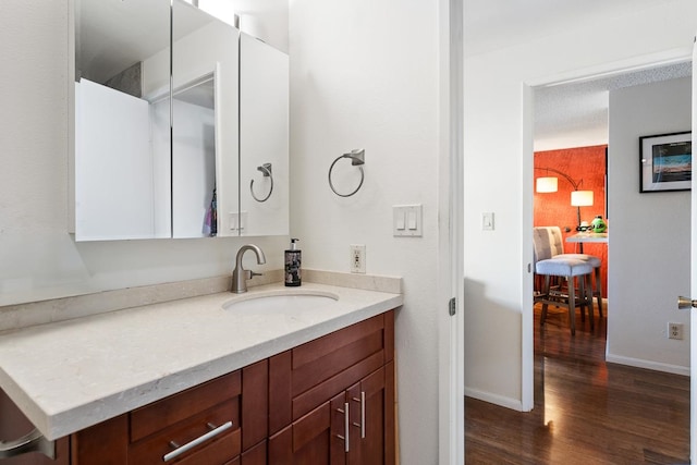 bathroom with vanity and wood-type flooring