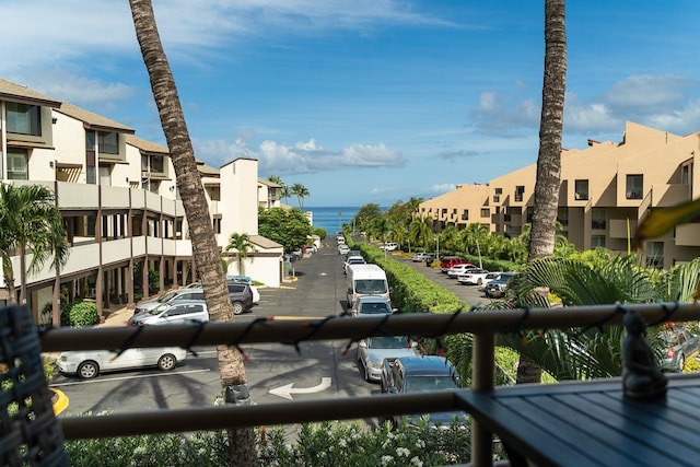 balcony featuring a water view