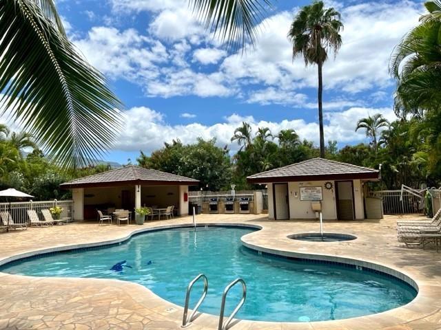 view of pool with a patio and an outdoor structure