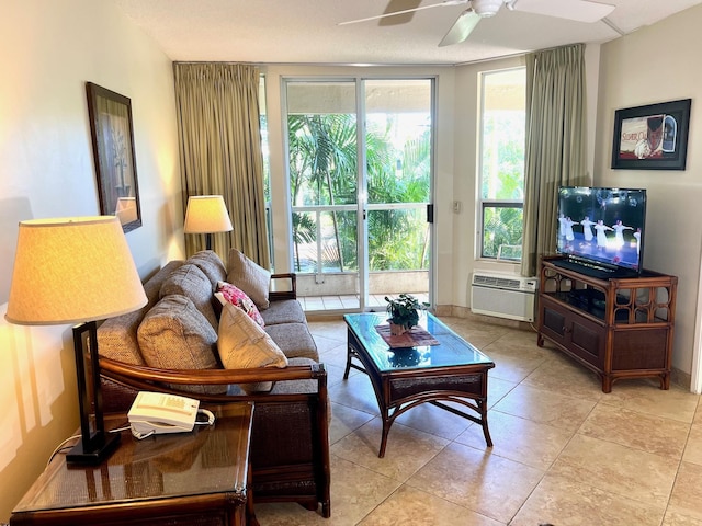 living room featuring ceiling fan, light tile patterned floors, and a wall mounted air conditioner