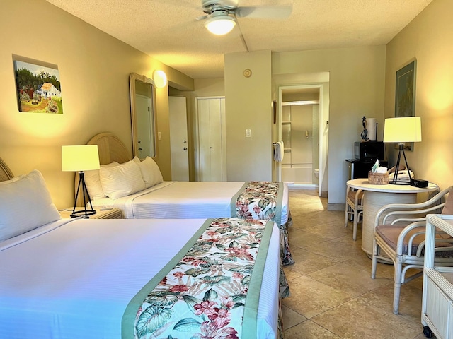 bedroom featuring a textured ceiling and ceiling fan