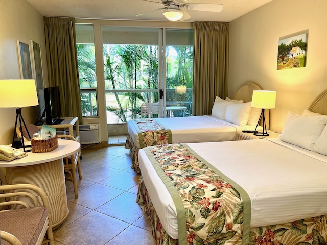 tiled bedroom featuring ceiling fan