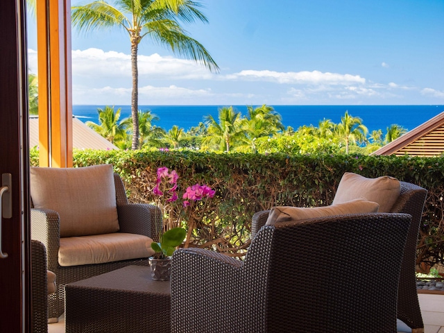 balcony featuring a water view